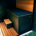Insulated cover strapped on the Revive Plunge Luxury Plunge Cold Plunge Tub beside a cedar deck at dusk