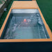 Overhead outdoor look into the Revive Plunge Luxury Plunge Cold Plunge Tub with icy water and glowing tub light