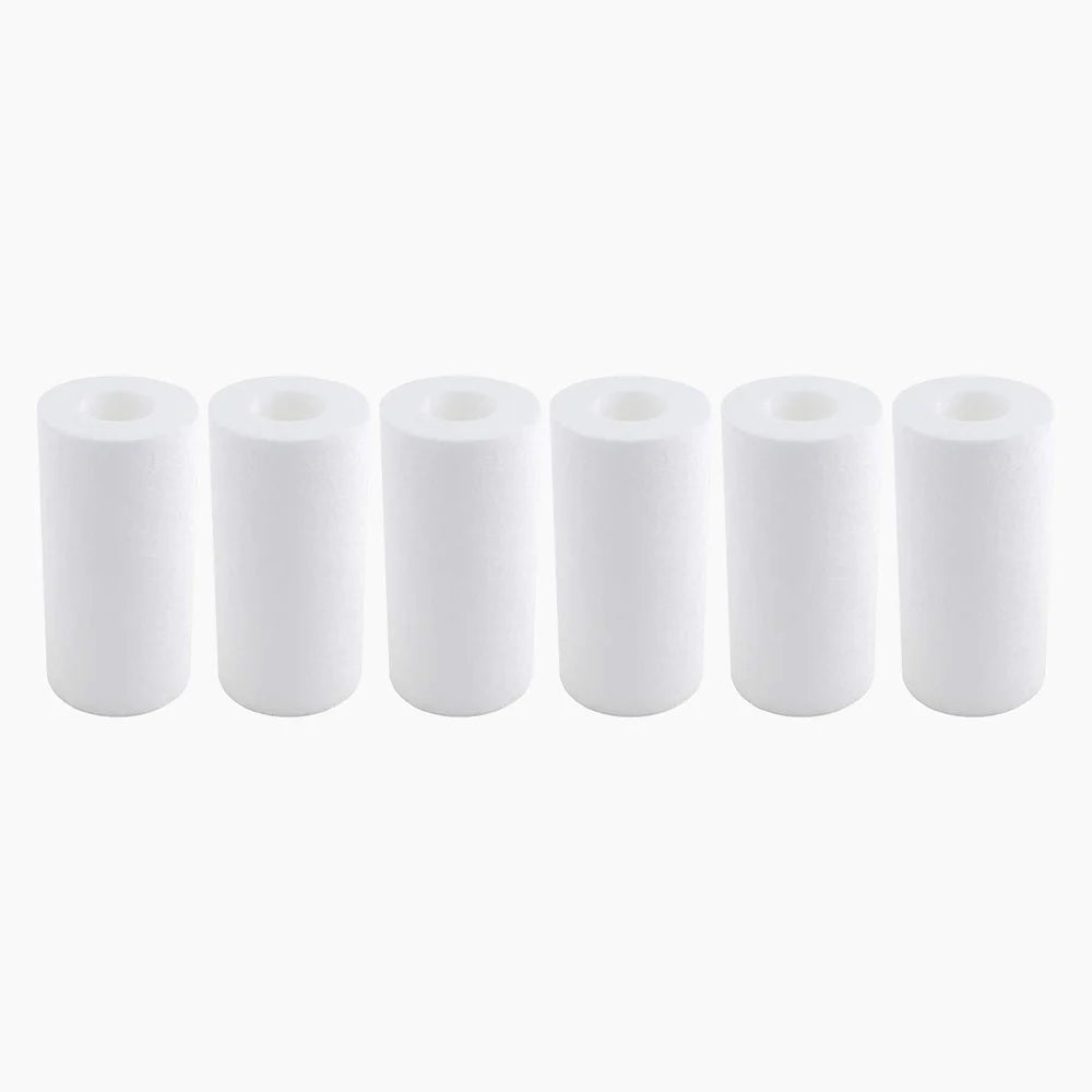 Six white spun sediment cartridges standing in a row make up the Revive Plunge Chiller Filter 6-Pack on white