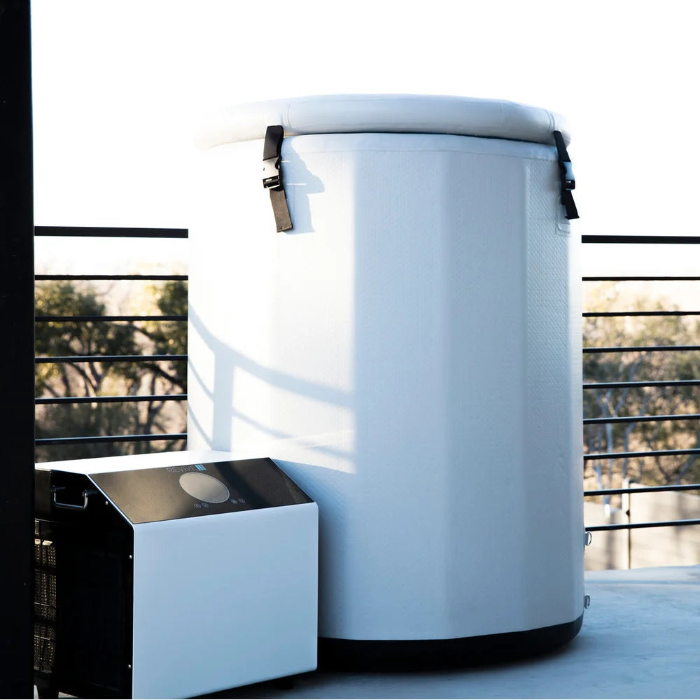 Covered white barrel tub and chiller unit on a deck showing the Revive Plunge Inflatable Barrel Plunge Portable Cold Plunge setup
