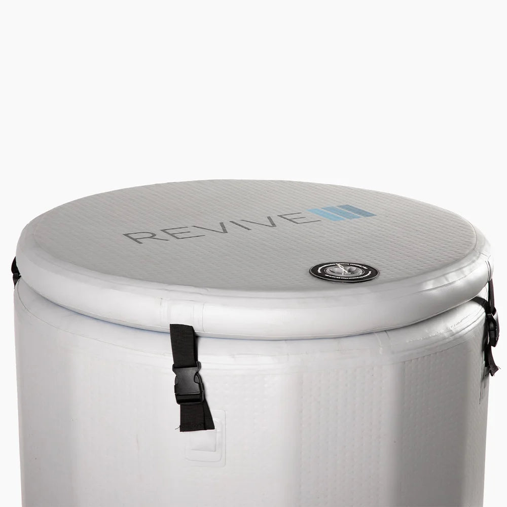 Close view of the strapped inflatable lid and valve on the Revive Plunge Inflatable Barrel Plunge Cold Plunge