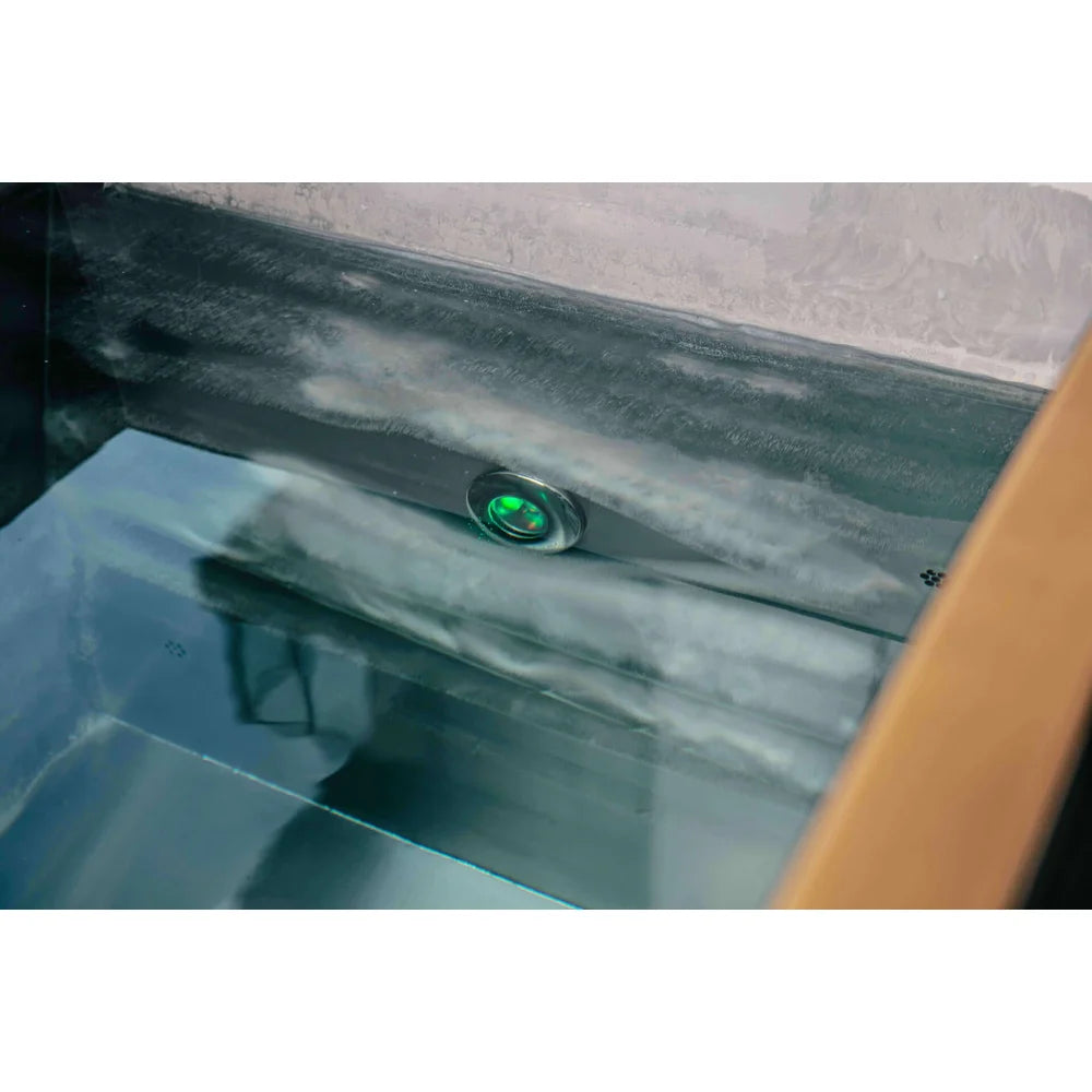 Recessed LED tub light glowing green under ice in the Revive Plunge Luxury Plunge Ice Bath Tub