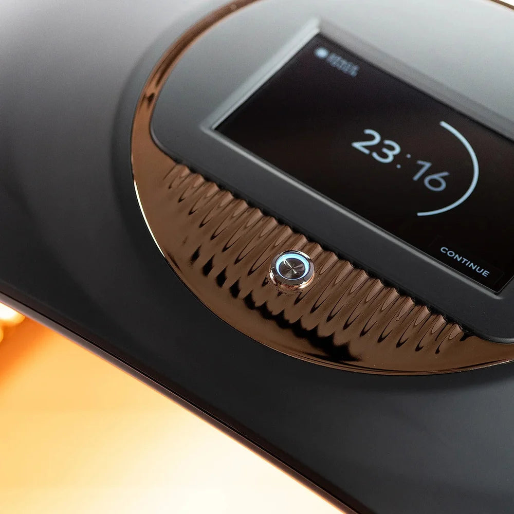 Screen counting down 23:16 during a session on the Galaxy Zero Atlas LED Therapy Device with warm light below