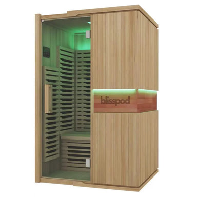 Green lit two person cabin shown at an angle on the Blisspod Milano Full Spectrum Sauna exterior