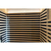Rows of black heaters across three interior walls below the ceiling light of the Blisspod Bergen Sauna