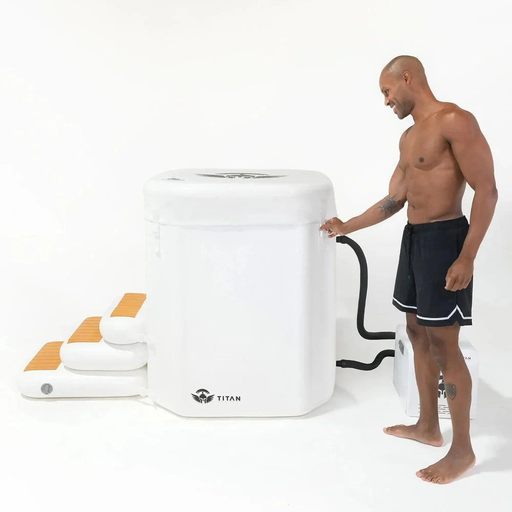 Arctic White Titan Atlas tub with insulated lid closed and a man standing beside the steps and chiller