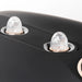 Two clear ribbed mist nozzles and speaker grille on the matte black shell of the Galaxy Zero Atlas Touchscreen LED Therapy unit