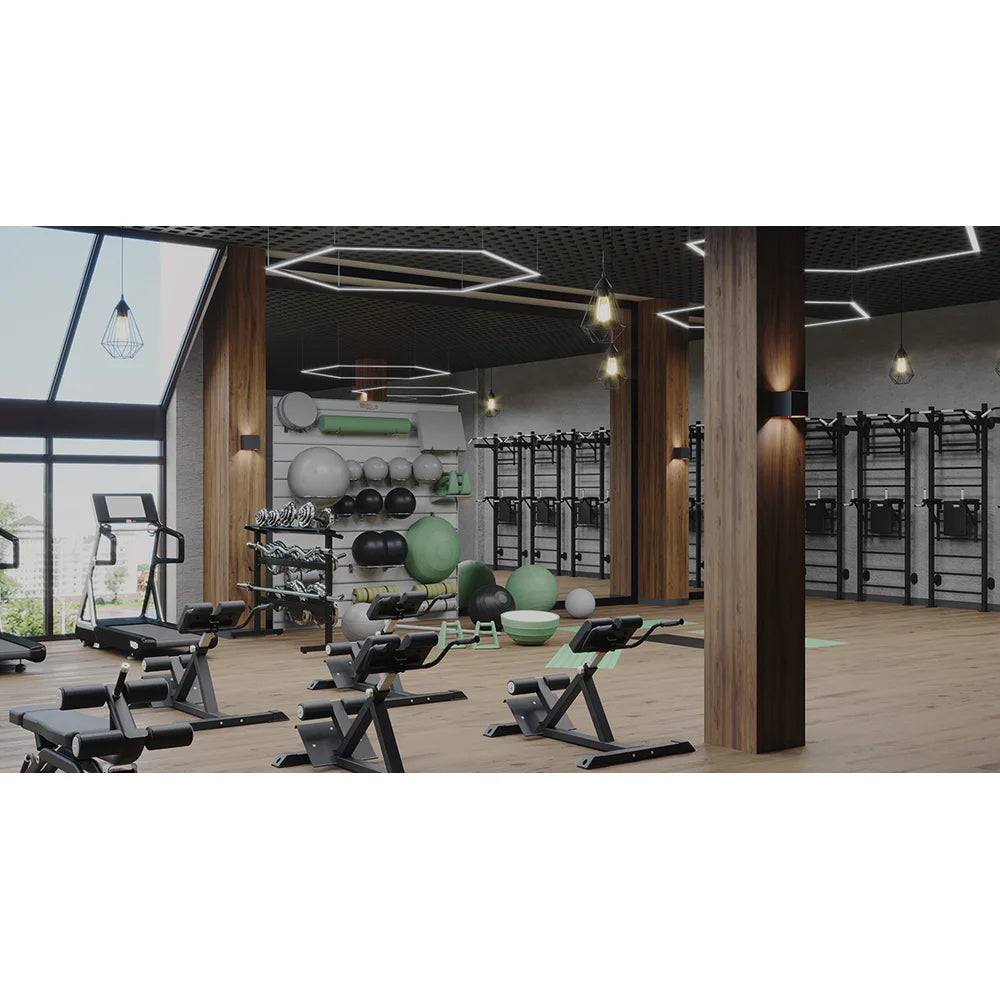 Modern gym floor with benches and weights, a fitness club setting for the Vacu Activ Cryo Flow Local Cryotherapy Unit