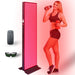 Illuminated EXESAS Full Body LED Red Light Therapy Panel on its base stand with remote, sunglasses and a woman