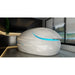 Glossy white pod with closed lid and blue lit door seam beside a window, the Dreampod Vmax Float Pod in a spa room