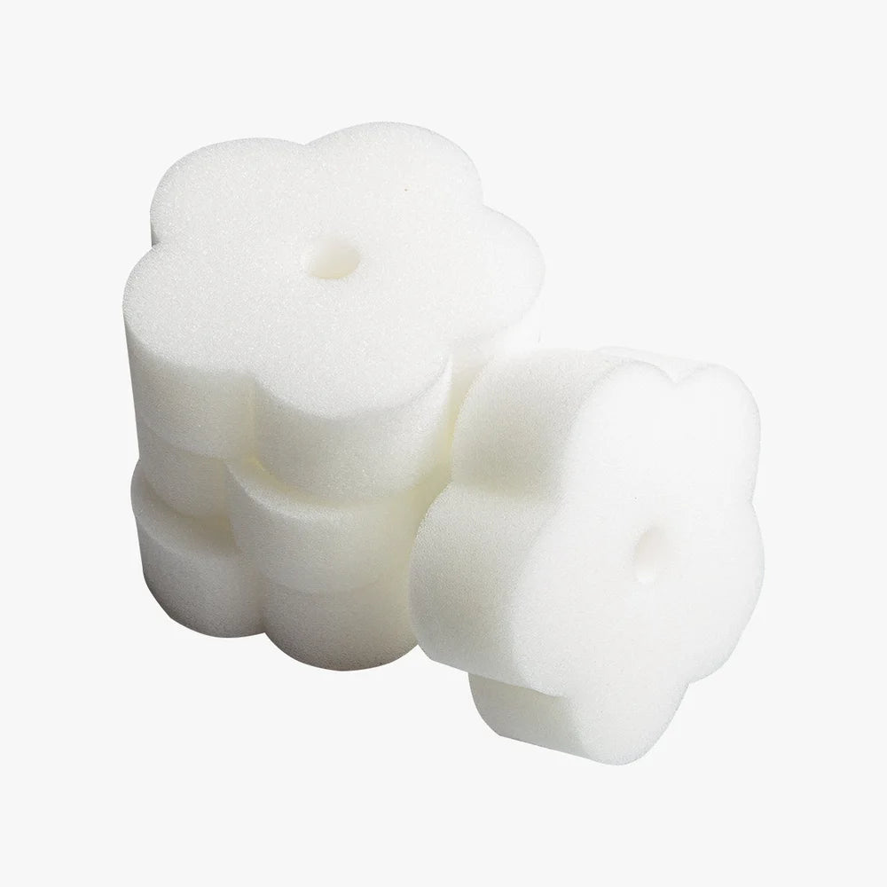 Flower-shaped foam oil absorbers included with the Revive Plunge Inflatable Cold Plunge Pool on white