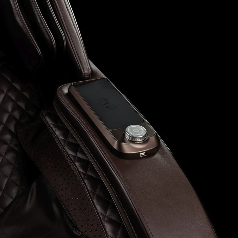 Armrest wireless charging pad, USB port and chrome smart dial controller on the Infinity Dynasty 4D