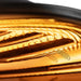 Warm yellow 590 nm diodes glowing across the mirrored inner panel of the Galaxy Zero Atlas LED Light Therapy Capsule