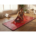 ZAQ LIVO full-body red light therapy mat in a yoga room